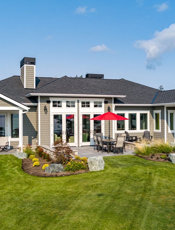 modern stone and white plaster home