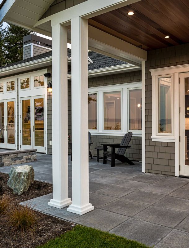 guest how with wood siding and vibrant landscaping